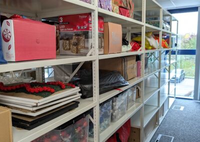 TopCashback Storeroom Shelving - Miscellaneous items on a white metal shelving system.