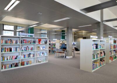 Mid Kent College Campus - Library space containing back to back Library shelving units.