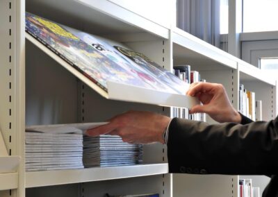 Mid Kent College Campus - Hinged section to the Library Shelving, allowing the storage of old copy journals.