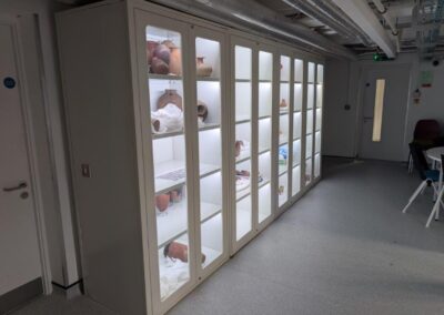 Garstang Museum Liverpool - Metal Cabinet with open door, showing off artifacts.