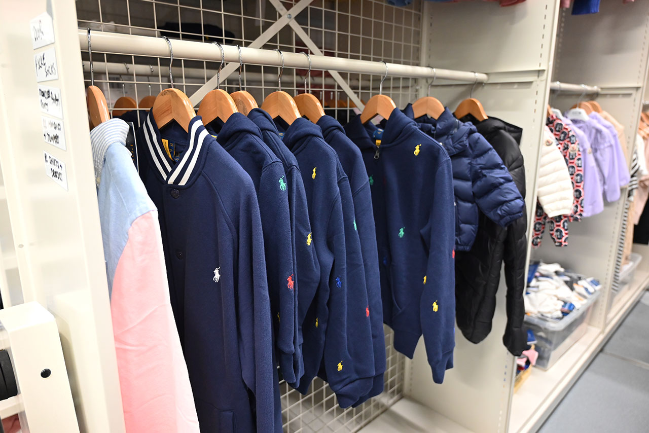 Garment rail storage in a retail stockroom, part of a shopfitting storage system