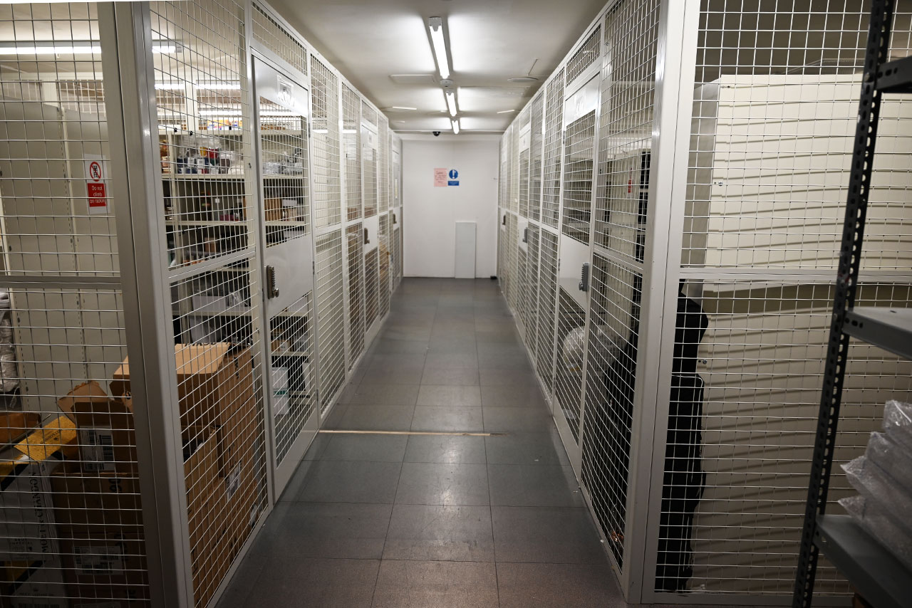 Static shelving used for stockroom storage of handbags and accessories