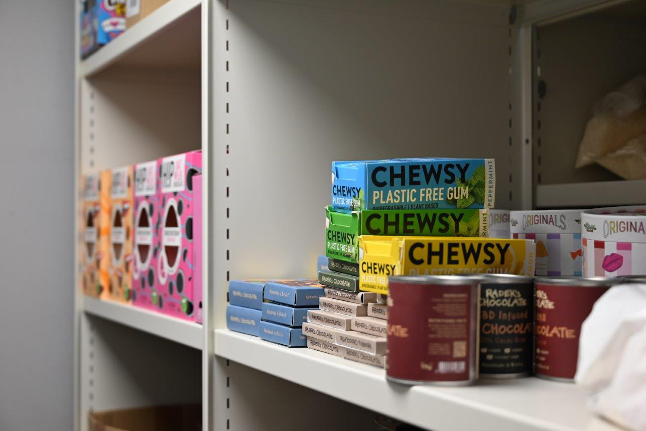 Retail stockroom shelving holding boxed confectionery stock